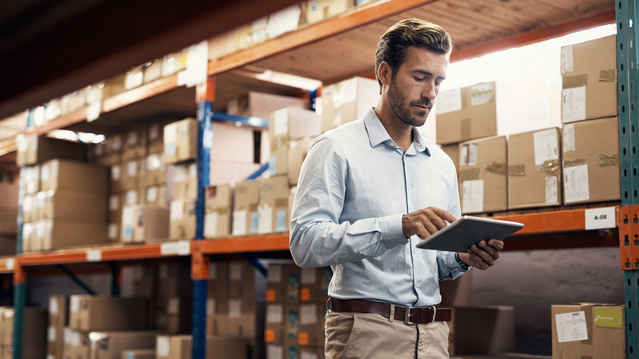 Business man working on his tablet device