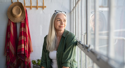 Woman looking through the window